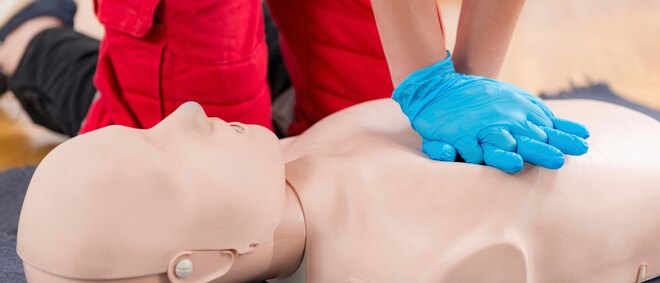 First Aid Training. Cardiopulmonary resuscitation. First aid course on cpr dummy.