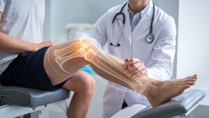 Knee pain surgery options concepts. A doctor examining a patient's knee with a visual emphasis on joint anatomy.