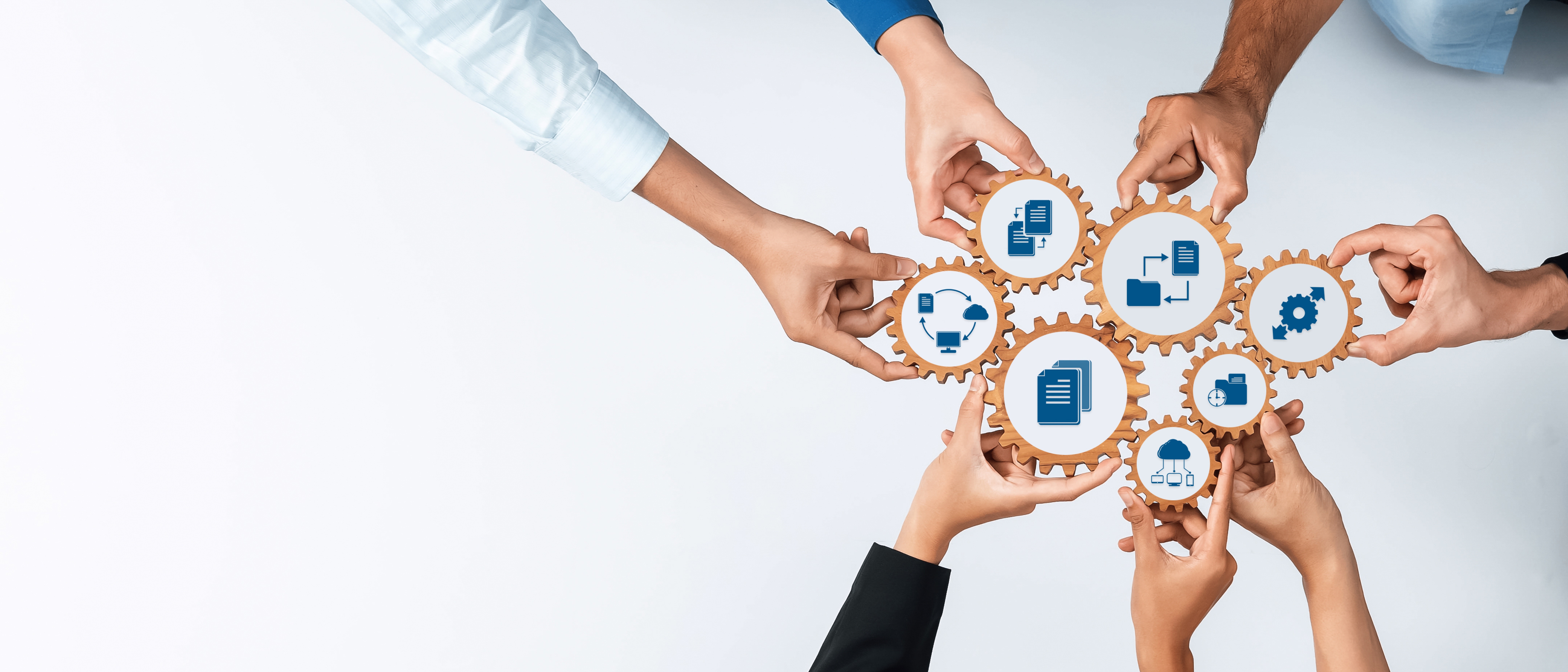 Hands unite over gears to symbolize teamwork and management strategies in a modern business context, emphasizing innovation and collaborative processes in achieving goals. Amity 